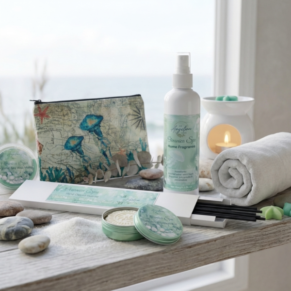 Oceanica Spa Home Fragrance Collection by The Angelina Store. Beautiful lifestyle display featuring the Oceanica Spa Room Spray, hand-dipped incense sticks, wax melts, Natural Lotion Bar, and sculptural pillar candles. Complete spa-inspired home fragrance set with jellyfish-themed pouch and natural elements. Calming coastal collection perfect for creating a serene, beach-inspired atmosphere in any home.