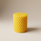 Bright yellow Limoncello Crème Bubble Pillar Candle from The Angelina Store. Cheerful handcrafted candle featuring a fun and tactile raised bubble texture in a vibrant sunny yellow color. Infused with a luxurious Limoncello Crème fragrance — sweet, zesty lemon with creamy vanilla notes. Premium artisan bubble candle perfect for kitchen decor, summer gifting, or adding a burst of citrus happiness to any space.