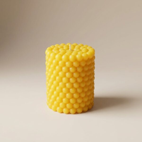 Bright yellow Limoncello Crème Bubble Pillar Candle from The Angelina Store. Cheerful handcrafted candle featuring a fun and tactile raised bubble texture in a vibrant sunny yellow color. Infused with a luxurious Limoncello Crème fragrance — sweet, zesty lemon with creamy vanilla notes. Premium artisan bubble candle perfect for kitchen decor, summer gifting, or adding a burst of citrus happiness to any space.