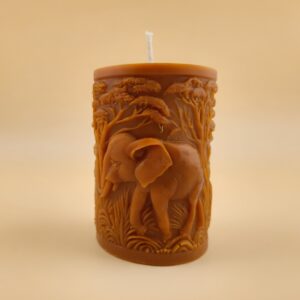 Close-up of the Elephant Pillar candle from The Angelina Store – a handcrafted caramel pillar candle featuring a detailed elephant and sacred tree design, infused with rich Nag Champa fragrance.