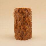 Close-up of the Waves Pillar candle from The Angelina Store – a handcrafted caramel pillar candle covered in elegant swirling wave patterns, infused with rich Nag Champa fragrance.