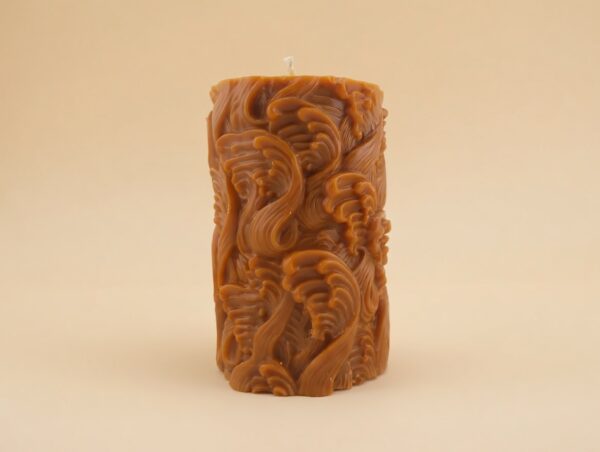 Close-up of the Waves Pillar candle from The Angelina Store – a handcrafted caramel pillar candle covered in elegant swirling wave patterns, infused with rich Nag Champa fragrance.