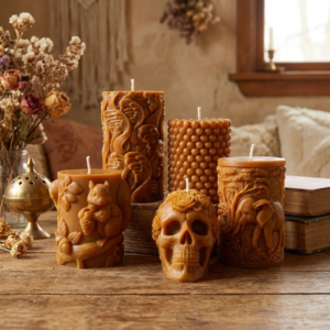 Beautiful collection photo of The Angelina Store's Nag Champa Pillar Candles. Five unique hand-poured caramel pillar candles showcasing detailed designs: Sugar Skull with roses, Elephant in the jungle, Bubble texture, Woodland Squirrel, and Flowing Waves. Premium beeswax-soy blend candles filled with deep sandalwood and Nag Champa fragrance.